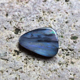 Blue stone on a textured gray surface