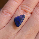 Blue gemstone on a hand