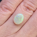 Opal stone on a hand