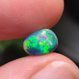 Bright Green Crystal Opal with Inclusions, 0.99ct from Lighting Ridge, AUS