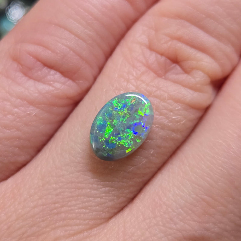 Opal stone on finger 