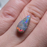 Opal stone held on finger