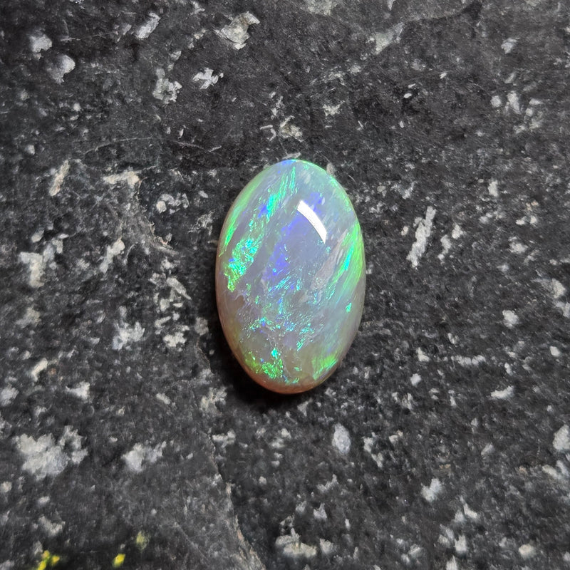 Opal stone on a dark textured background
