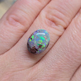 Opal stone on a hand